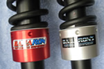 Suspension adjusters